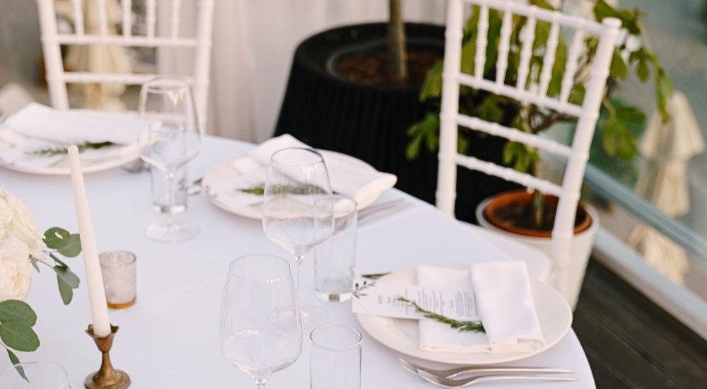 Tableware, table and chairs, plates, glassware and cutlery rental in a event setting